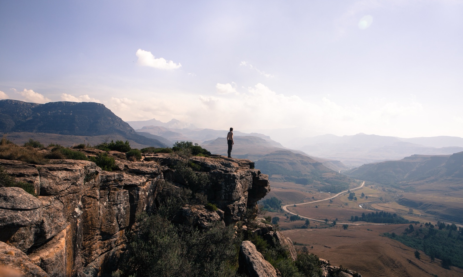 A 4x4 climbing a switchback cliff on the Sani Pass road